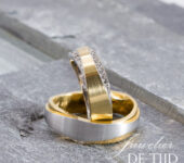 Bi-color geel/wit gouden trouwringen met briljant geslepen diamant